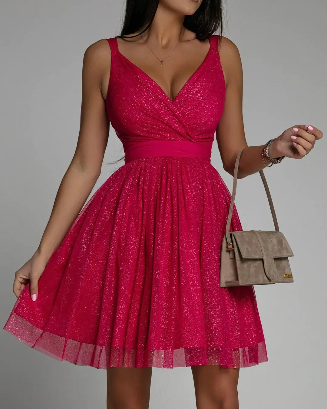 Elegant Glitter Sleeveless Deep V Neck Party Dress for Women in pink with a stylish handbag.